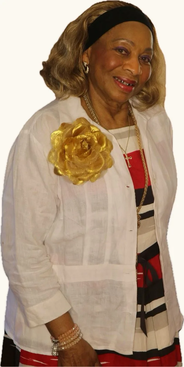 Missionary Katherine Cash Griffey in a white linen jacket pinned with a large gold rose.